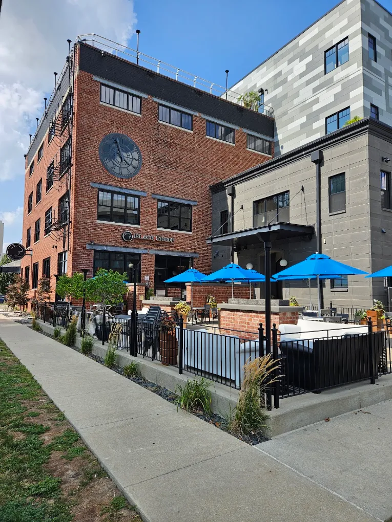 Black Sheep Social Club commercial outdoor patio in Cedar Rapids with seating and integrated fire features